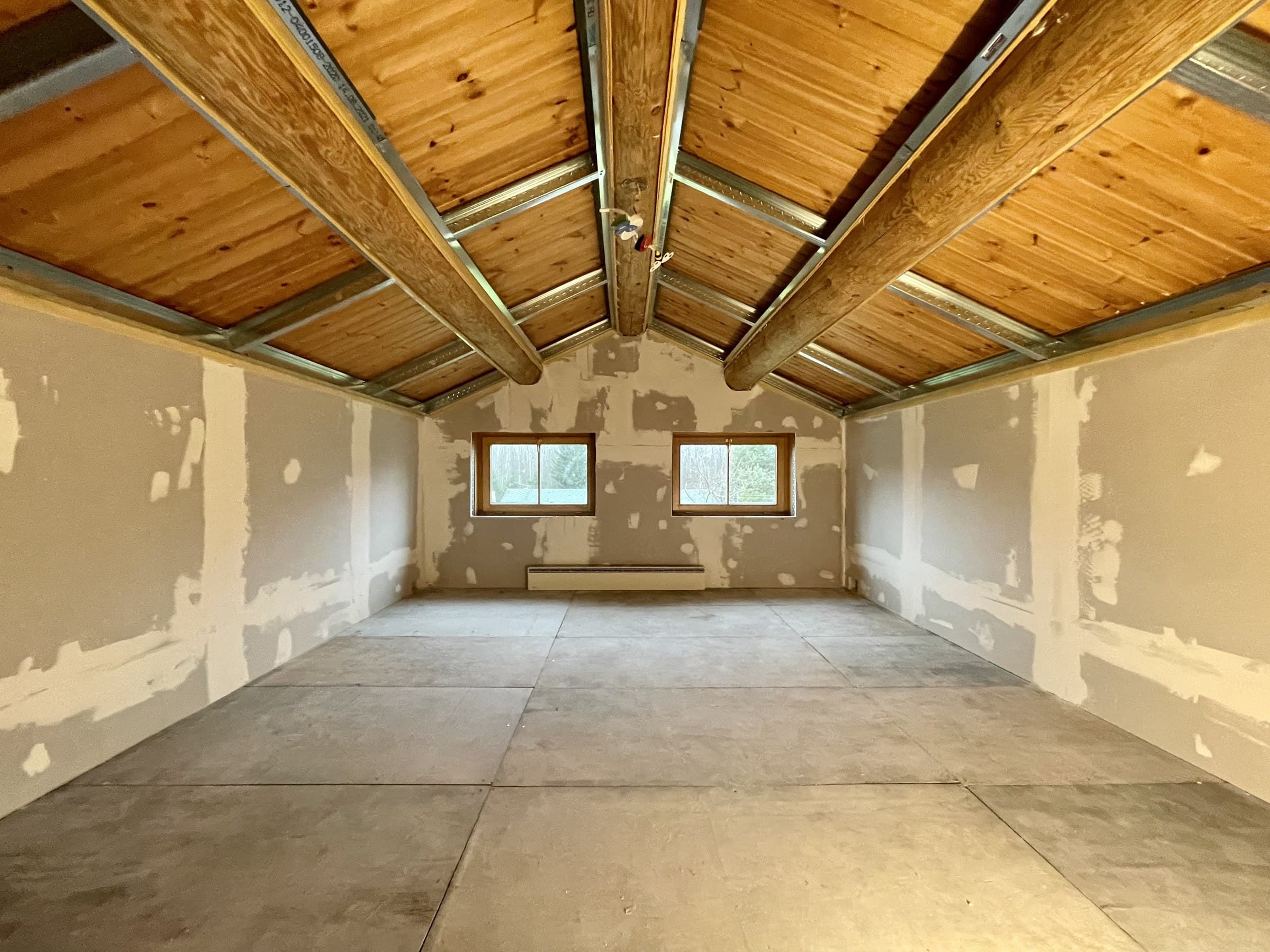 Drywall installed and taped, ready for finishing